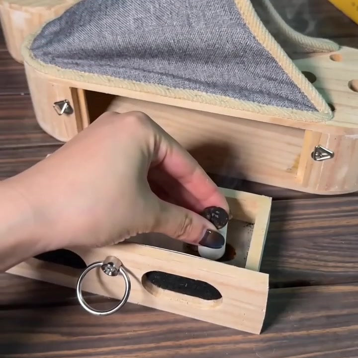 gently pressing a mugwort stick between fingers over the open drawer